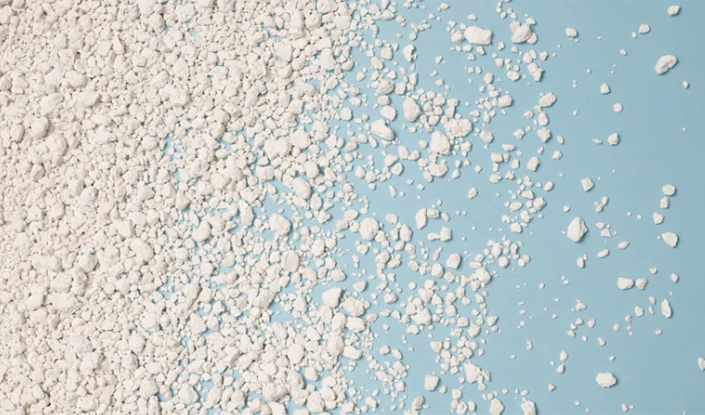 Birdseye view of the product scattered across a blue surface 